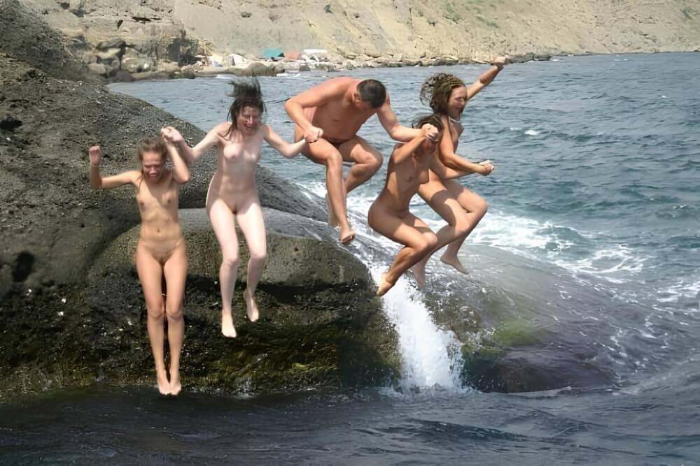 Mens and girls nudists on a beach - nudism in the world